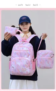 Three-piece pink camouflage kids backpack set including crossbody bag and pencil case