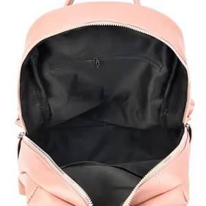 Internal view of pink PU leather backpack showing black fabric lining and zippered pocket