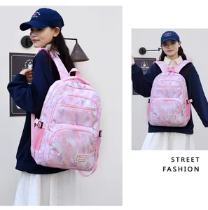 Detail showing pink camouflage kids backpack with Sport SIBANHUA label and side mesh pockets