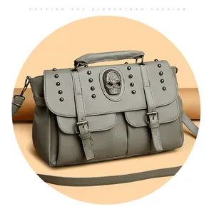 Grey vintage gothic handbag with skull emblem and metal studs, crossbody style for women