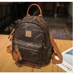 Close-up of brown leather backpack featuring patterned monogram and golden brand plate