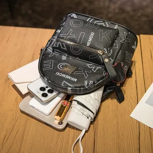 Chic black mini backpack with letter print, showing daily essentials storage capacity