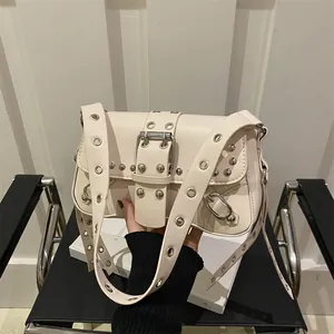 Cream white punk faux leather shoulder bag with rivets and large metal buckle detail