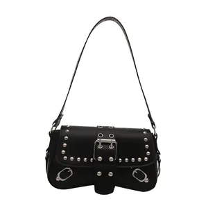 Y2K punk style black shoulder bag with silver studs and metal buckle on white background