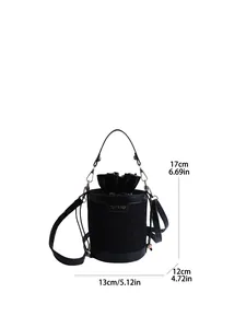 Detailed view of black bucket bag dimensions with gold hardware and drawstring closure