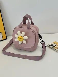 Pink canvas crossbody bag featuring a 3D smiley daisy flower with adjustable strap