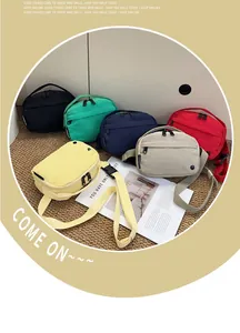 Detailed view of colorful nylon crossbody bags with adjustable straps and buckle closures