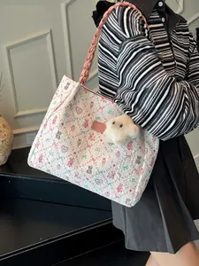 Cute off-white tote bag with pink bow and bear prints, featuring a plush cloud charm