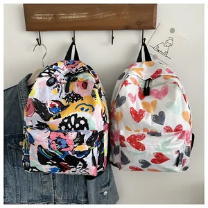 Detail view of colorful graffiti and heart print waterproof nylon backpacks for students