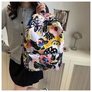 Lifestyle view of large capacity backpack with colorful abstract graffiti print for women