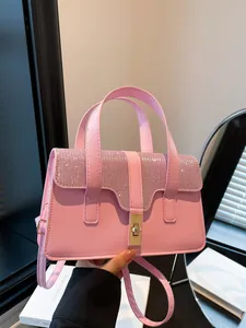 Pink rhinestone handbag for women with metallic lock and adjustable crossbody strap