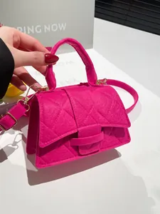 Chic magenta quilted felt crossbody bag with gold hardware and top handle for women