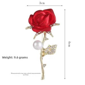 Detail view of red rose brooch with dimensions 3cm x 6cm and 9.6g weight info