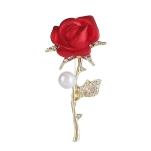 Elegant red rose brooch with gold metal stem, white pearl and crystal accents