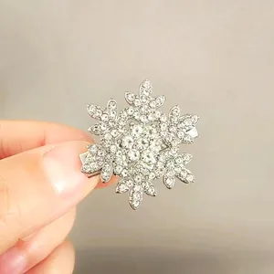 Close-up of sparkling rhinestone snowflake hair clip with a silver metal finish