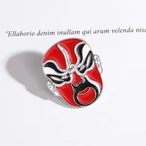 Exquisite Peking Opera mask enamel brooch with traditional red and white facial patterns