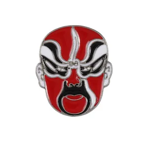Traditional Chinese Opera face mask brooch in red and black enamel with silver metal finish
