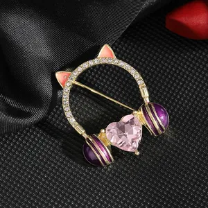 Cat ear headset brooch with pink heart crystal and rhinestones in gold finish