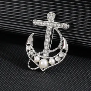 Sparkling silver anchor brooch with inlaid rhinestones and white pearls for suits