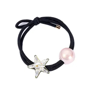 Sparkling starfish hair tie with pink bead and zircon accents on black elastic band