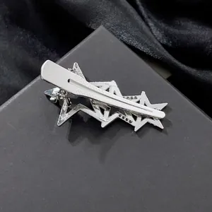 Chic silver hollow star hair clip with tiered geometric design and duckbill clip grip