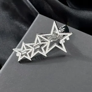 Polished silver hollow star hair clip featuring a layered triple pentagram metal design