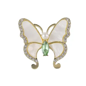 Eleganter Schmetterlingsbrosche mit Muscheleinlage, Strass und olivgrünem Kristall-Akzent
