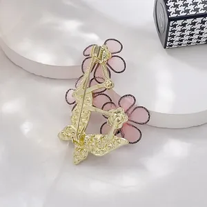 Elegant butterfly flower brooch with pink mesh petals and gold metal finish back view