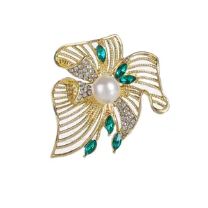 Elegant gold flower brooch with emerald marquise stones and center pearl for women