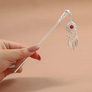 Ethnic Miao silver hair pin with red bead and feather tassels in vintage Chinese style