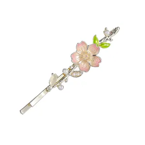 Pink cherry blossom hair clip with gold alloy, green leaves and white pearls for women