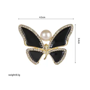 Detail view of butterfly brooch with black enamel, pearls and crystals, size 4.5x3.4cm