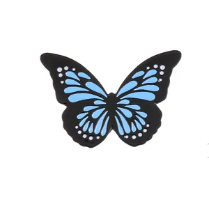 Glow-in-the-dark butterfly couple brooch with blue enamel wings and white dot details