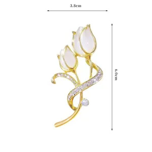 Macro detail of tulip brooch with dimensions 3.8cm by 6.0cm and gold metal finish