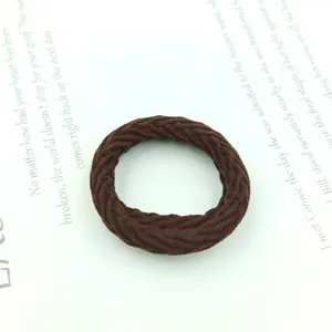 Detailed view of dark coffee spiral braided high elasticity hair scrunchie texture