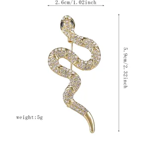 Sparkling snake brooch with crystals and gold plating, size 2.6cm by 5.9cm elegant design