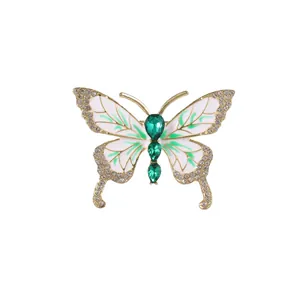 Eleganter Gold-Schmetterling-Brosche mit grünen Kristallen und Emaille-Inlays