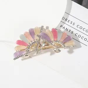 Elegant silver fan-shaped hair claw clip with colorful cat eye stones and rhinestones