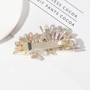 Gold fan-shaped spring hair clip with pastel beads for high ponytail hairstyles