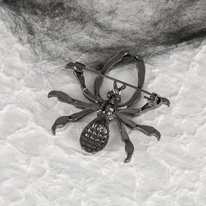 Dark metal spider brooch with detailed back pin and gothic halloween style textures