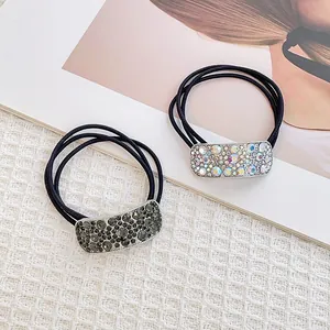 Double pack of geometric rhinestone hair ties with black elastic bands and crystals