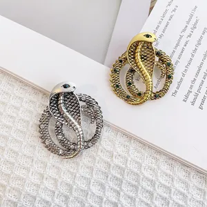 Vintage-Kobra-Brosche in Gold und Silber mit funkelnden Strasssteinen besetzt