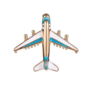 Broche avion dorée avec émail bleu et blanc pour accessoires de mode féminins