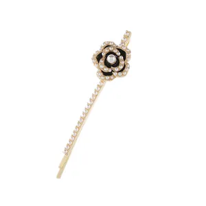 Elegant gold hair clip with black camellia flower, white pearls and sparkling crystals