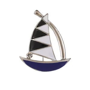 Vintage enamel steamship brooch with silver frame and geometric sailboat design