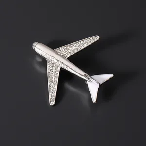 Exquisite silver airplane brooch pin with sparkling rhinestones and white enamel finish