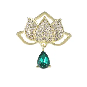 Elegant lotus flower brooch with emerald green crystal drop and sparkling rhinestones