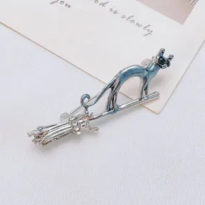 Exquisite silver cat on flying broom brooch with blue enamel and sparkling crystals