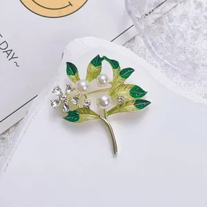 Vintage green enamel flower brooch with white pearls and crystals on stone base