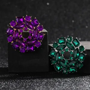 Luxury multi-layered emerald and purple crystal floral brooch with facet cut gemstones
